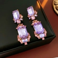 Macro shot of vintage gold earrings with large lavender rectangle and pink stones - Silver Earring Post - Purple