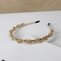 Detailed macro view of champagne crystal headband with sparkling rhinestones and gold base - Style SJ007 / Cross Champagne