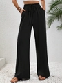 Detail einer schwarzen Weitbeinhose mit hoher Taille, Kordelzug und Strukturstoff - S / Unterteile / Schwarz