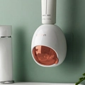 Wall-mounted automatic toothpaste dispenser in rouge pink finish for bathroom storage - Carmine Pink