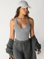 Close-up of dark grey ribbed knit bodysuit with deep V-neck and racerback detail - XS / Tops / Light Gray