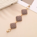 Detail of houndstooth fabric and metal alloy bracelet strap with magnetic clasp - K759 Square Khaki Houndstooth