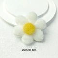 Detailed view of a 6cm plush flower accessory with white petals and yellow center - White