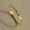 Macro detail of 18k gold plated bangle featuring geometric squares and cubic zirconia inlay - Square Block Inlaid / 2# Gold