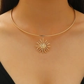 Minimalist gold sun pendant choker necklace featuring a vintage sun god relief design - Sun Face Pendant Gold Style (KC Gold A-581)