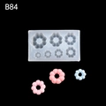 Silicone fondant mold for mini twists and flower donuts with 7 cavities in white - B84