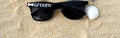 Black groom wedding sunglasses with white Groom text and bow tie print on sand - Groom / Black (Groom)