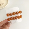 Jelly amber heart and bead hair clip set with marble texture on display card - Amber