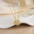Detailed macro view of gold-plated sun and moon necklaces with white zircon inlays - Splicing Sun Moon Couple Style (XL0282)
