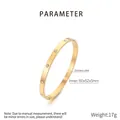 Golden titanium steel bangle with sparkling zircons and a polished finish for couples - 60*52*5mm / Gold