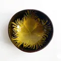 Artisan coconut shell bowl featuring yellow feather pattern and natural brown exterior - Yellow Feather Style