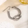 Minimalist double-layered silver snake chain bracelet with a central knot design - Bracelet / Silver