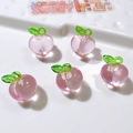 Five pink transparent acrylic peach charms with green leaves for DIY phone case jewelry - Peach