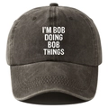 Washed black cotton baseball cap with white I'M BOB DOING BOB THINGS slogan print - Adjustable / Coffee