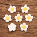 White flower resin charms with yellow center and metal hanging loops for DIY jewelry - White