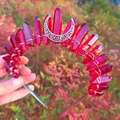 Close-up of red crystals and silver crescent moon detail on a handmade wicca crown - Wine Red + White K Moon