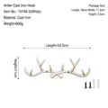 Retro antler wall hook made of white cast iron with rustic finish and mounting screws - White Distressed