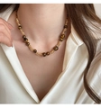 Close-up of tiger eye beaded necklace with gold metal links on model neck - Metal Wrapped Tiger Eye Bead Necklace (17# Necklace-Gold-Coffee)
