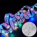 Multi-color LED Christmas ribbon light with star and snowflake patterns on silver gauze - 1M 10-LED Battery Powered / Silver Ribbon (Multicolor Light)