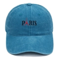 Close-up of Paris embroidery and Eiffel Tower graphic on washed blue cotton baseball cap - Lake Blue