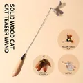 Long wooden wand cat toy featuring three interchangeable natural feather lures - Spring Wood Handle Teaser / Spring Wood Wand With Insect Heads