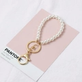 White glass pearl keychain with golden metal lobster clasp on rose quartz background - 8-Loop KC Gold Keychain