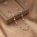 Elegant French vintage pearl bracelet with gold metal beads on brown leather box - Gold