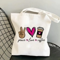 White canvas tote bag featuring peace love coffee print displayed on a black metal chair - Black and Pink Tone Pattern Style (B100308-TBWH-M)