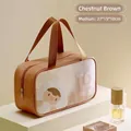 Brown PU cosmetic bag detail showing toast cartoon print and sturdy double handles - Medium / Chestnut Brown