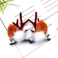 Brown Christmas reindeer antler hair clips with white plush balls on book background - Coffee Mink Fur