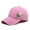Detail of pink vintage washed cotton baseball cap with white daisy floral embroidery - One Size / Pink