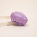Portable egg-shaped detangling hairbrush in matte purple gradient finish for smooth hair - Solid Purple