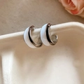 Macro shot of 18k gold plated C-shaped double layered earrings with white enamel finish - Silver/White Striped Half-Circle