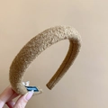Close-up of brown plush fabric headband with handmade tag and soft wool texture - Dark Coffee