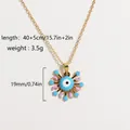 Detail of gold evil eye pendant with blue sunburst, star and moon enamel patterns - Blue Eye Star Moon Celestial Style (Style 6)