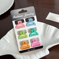 Set of 6 matte macaron mini hair claws in pink, blue and green on a fashion jewelry card - Set 12