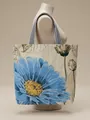 Retro canvas tote bag featuring large blue floral print and striped woven handles - Orchid
