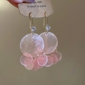 Detail of pink shell tassel earrings with zircon studs and golden geometric accents - Pink Ear Buckle