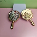 Golden rose shaped folding pocket makeup mirror with double sided 3D embossed floral design - Handheld / Rose Gold