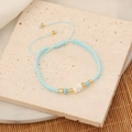 Detailed close-up of light blue seed bead bracelet with golden accents on stone - Lake Blue (3#)