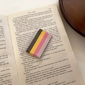 Set of colorful matte hair clips arranged on open vintage book pages for girls - Coffee Yellow Pink Flat Style