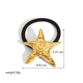 Black elastic hair tie featuring a polished gold 18k plated starfish metal charm - Starfish