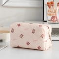 Pink quilted travel makeup bag featuring a cute cartoon bear and la-la-la pattern print - Bear