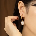 Elegant gold titanium steel hoop earrings featuring classic white round pearl drops - Slender Hoop Pearl Drop Earrings (E806-GO)