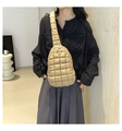 Close-up of beige quilted crossbody bag with embroidery stitching on adjustable strap - Khaki