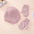 Detailed flat lay of soft pink knitted baby hat and matching mittens set on warm background - Hat Gloves Combo / Pink