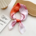 70cm square silk scarf with artistic orange and pink tie-dye pattern tied in a knot - Sea Wave Orange