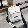 White canvas crossbody bag with yellow zipper and adjustable black nylon shoulder strap - White