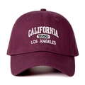 Detailed view of the white California 1850 embroidery on a burgundy cotton baseball cap - Adjustable / Burgundy