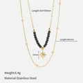 Detail of 18k gold double-layered stainless steel necklace with black beads and star pendant - Black Stone